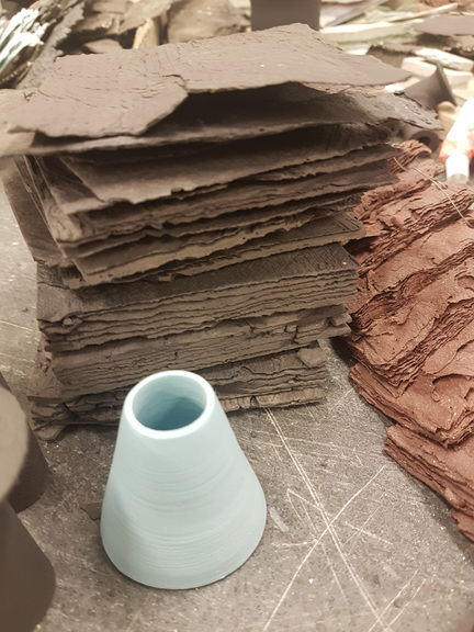 Thin layers of paper clay.
