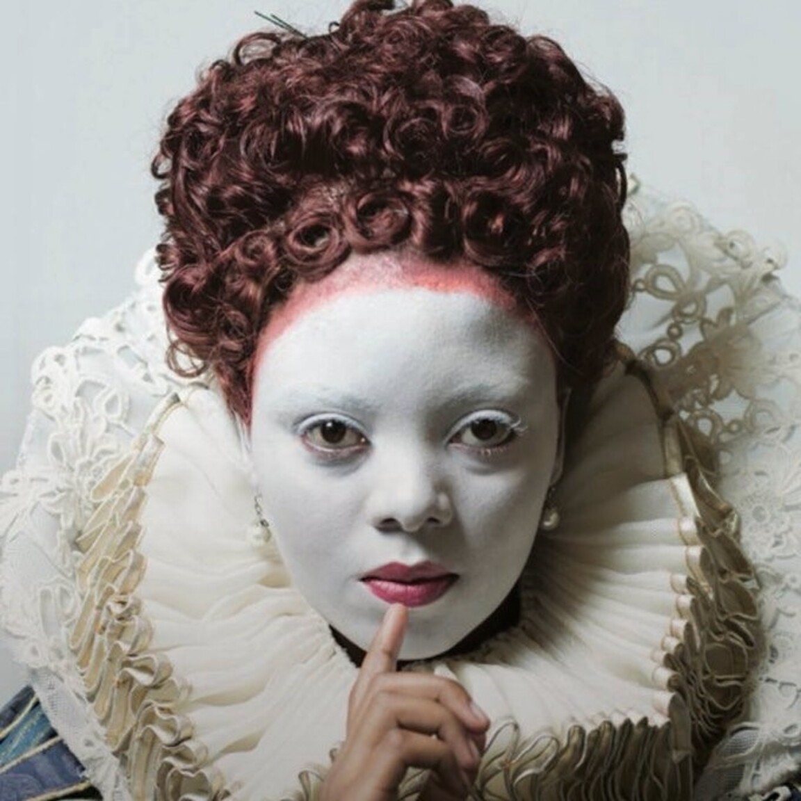Image credit: Noluvuyiso Mpofu in costume as the title character for Donizetti’s opera Maria Stuarda for a 2015 production at the Cape Town Opera. The make-up is common for modern depictions of women in Elizabethan England, especially for royalty and those in the Tudor dynasty. (Courtesy of Cape Town Opera, photographer Bernard Bruwer)