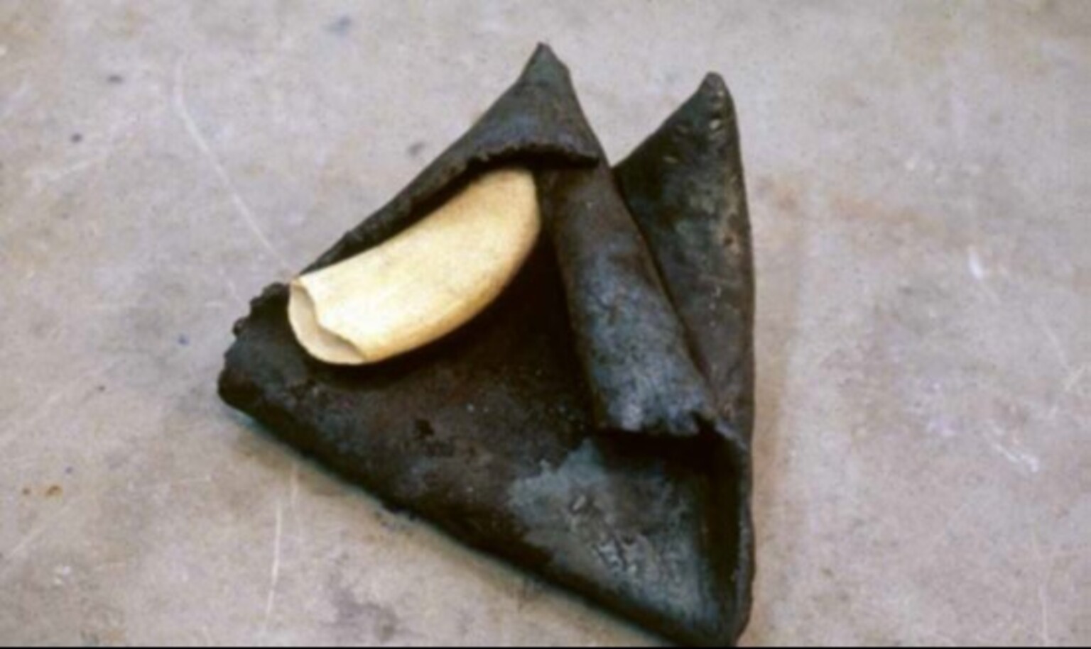 Germain Ngoma, Steel Bone, 1985, steel and whale tooth, c. 25 x 25 cm