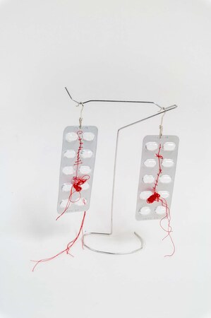 Peder Bye, „Ekstraslag”, earings, empty beta block pill trays, red sewing thread, silver
