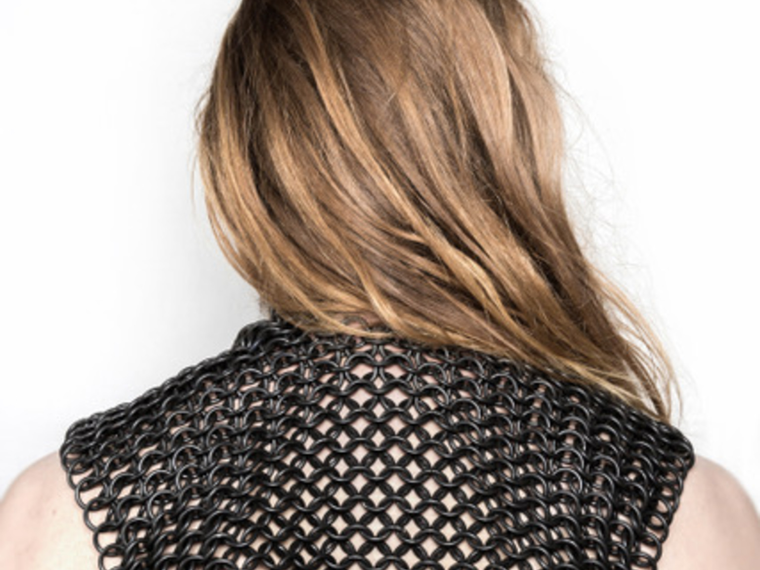 LONGING: Please Let It Be Me (back view), oxidized copper, silver,
75 x 39 x 2.5 cm, 6.5 kilos, photographer: Sigrid Kuusk, model: Taavi Teevet